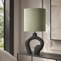 Lampe de table Loki 5831V in black styled inside a modern luxury living room avec natural window light and velvet carpet, photorealistic interior setting by Marcottestyle