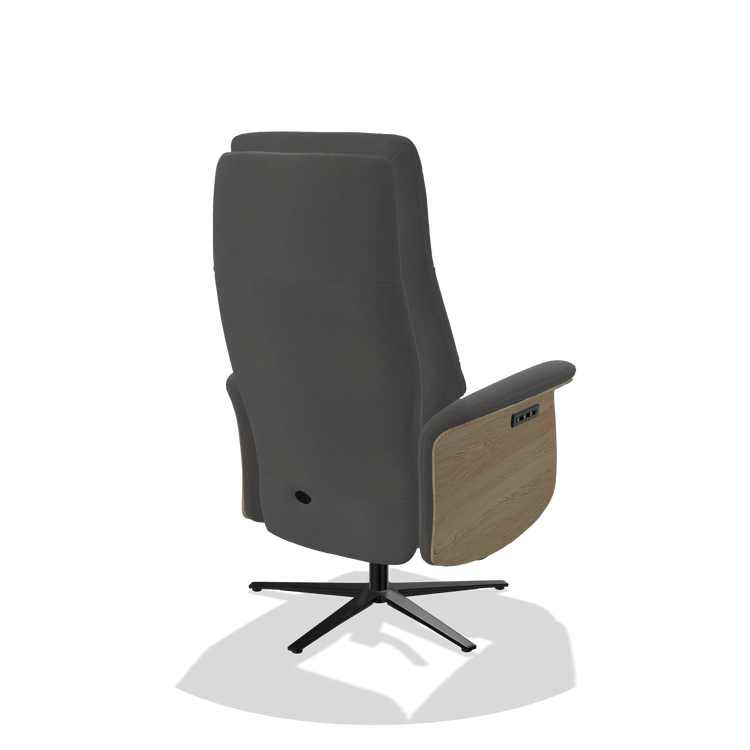 Recliner Atlas 6685 in Leather B502 (dark grey), natural wood side panels, black metal base, back angled view