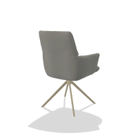 Chaise de salle à manger avec accoudoirs Flavia 6694 en Cuir B967 (grège), pied pivotant en champagne, vue de trois-quarts arrière