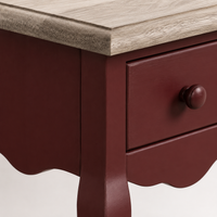 Close-up of the bordeaux paint and oak top detailing of the Cahors nightstand