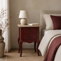 Cahors nightstand in bordeaux with oak top styled in a bedroom