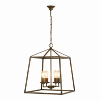 Nina 8541D rust pendant light with 4 candle bulbs gently illuminated showing warm ambient glow inside the open trapezium frame, 4xE27 contemporary classic ceiling lantern - studio front view on white background by Marcottestyle