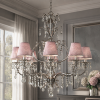Hängelampe Gus 3680V styled in modern luxury interior mit velvet accents and natural window light, photorealistic room setting highlighting antique silver finish by Marcottestyle