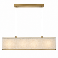 Pendant Light Nita 2441U brass finish front view with lights turned on showing warm glow through shade on white background by Marcottestyle