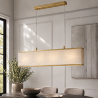 Pendant Light Nita 2441U brass finish styled in modern luxury room with natural window light and photorealistic interior setting by Marcottestyle