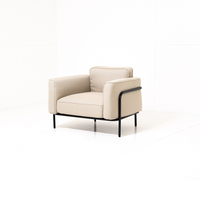 Beige Fauteuil with Zwart frame on a Wit background