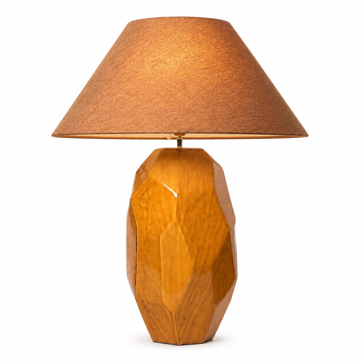 Table Lamp Thor 6126K with light turned on showing warm ambient glow through the fabric shade, geometric yellow ceramic base with subtle illumination highlighting the handcrafted texture and cozy atmosphere by Marcottestyle