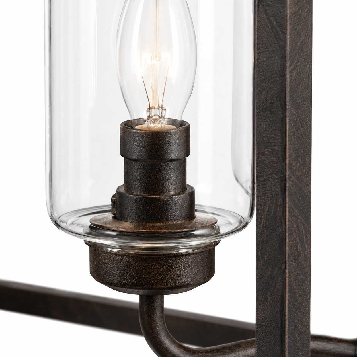 Macro close-up detail of Thora 2891A rust-finished pendant light showing aged textured metal finish, clear glass cylinder shade and Edison-style candle bulb of the 4xE27 square ceiling pendant by Marcottestyle
