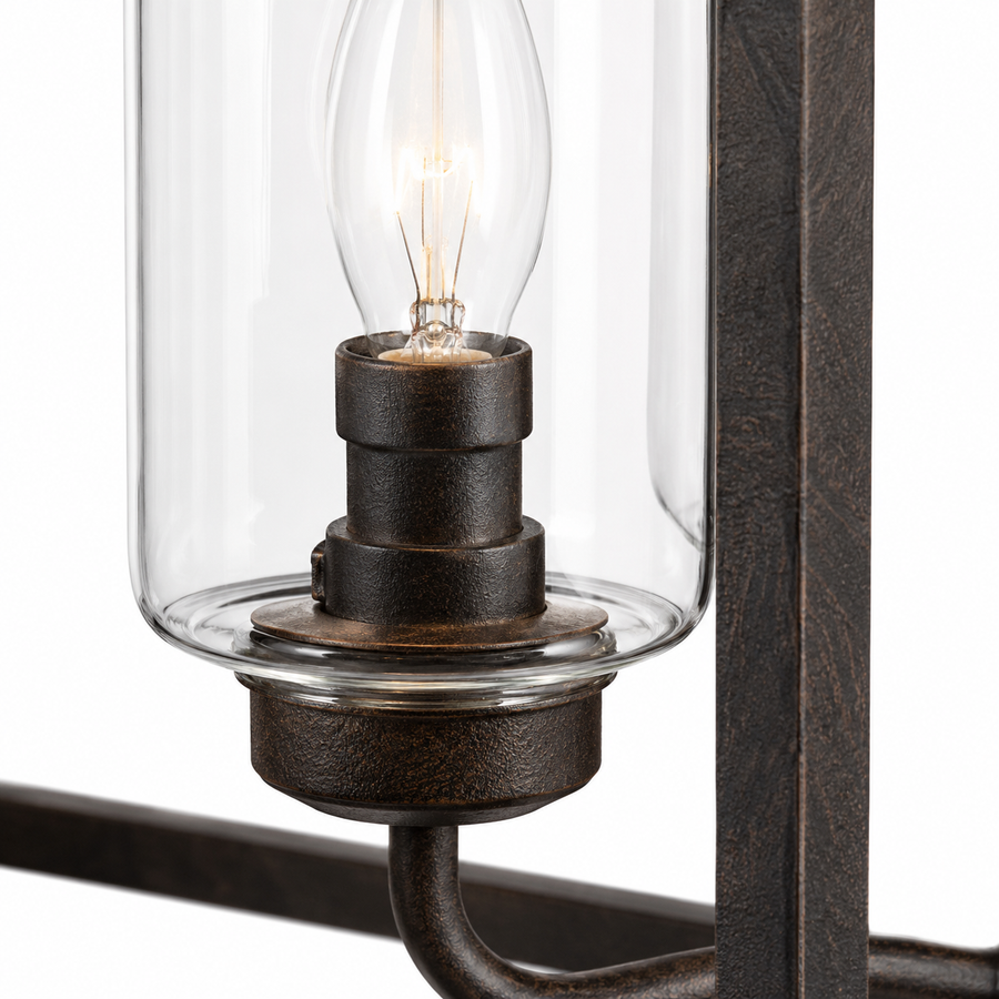 Macro close-up detail of Thora 2891A rust-finished pendant light showing aged textured metal finish, clear glass cylinder shade and Edison-style candle bulb of the 4xE27 square ceiling pendant by Marcottestyle