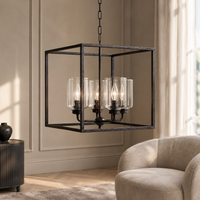 Thora 2891A rust pendant light hung in a modern living room with classic wall paneling, beige tufted armchair and large window with warm natural sunlight, 4xE27 square ceiling lantern lifestyle shot by Marcottestyle