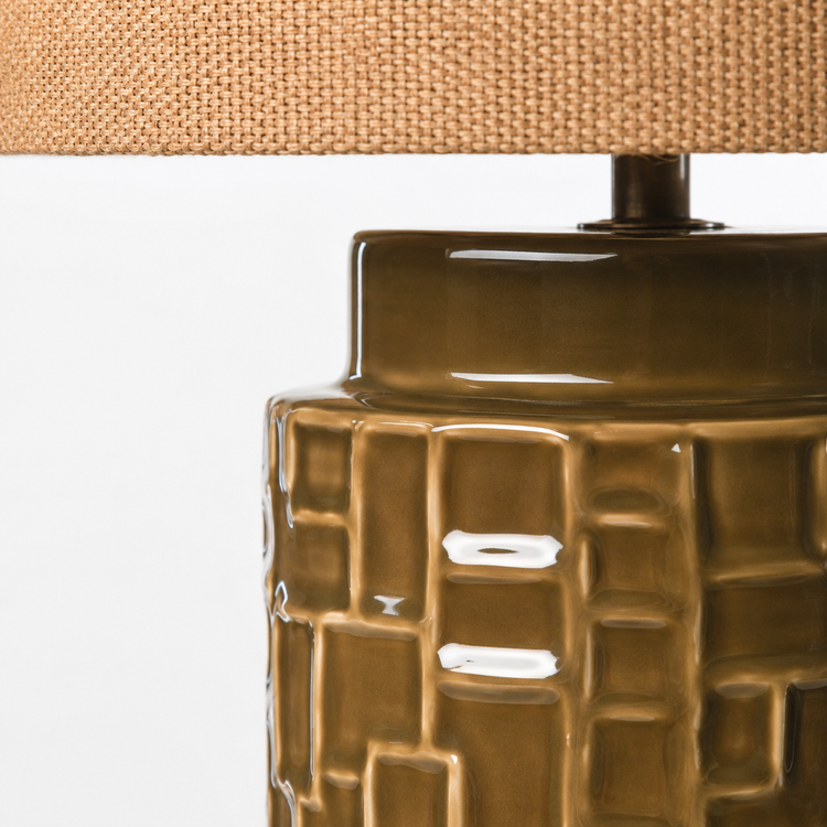Close-up macro detail of Table Lamp Tilda 3384Q olive ceramic base showing intricate textured surface pattern and material finish, high-resolution product photography by Marcottestyle