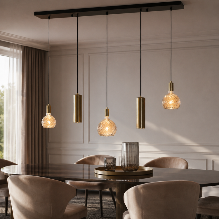 Tova 4353N pendant light suspended above a round wooden dining table in a contemporary classic interior with velvet upholstered chairs and warm sunlight from window, 5xE27 black and brushed brass ceiling pendant lifestyle shot by Marcottestyle
