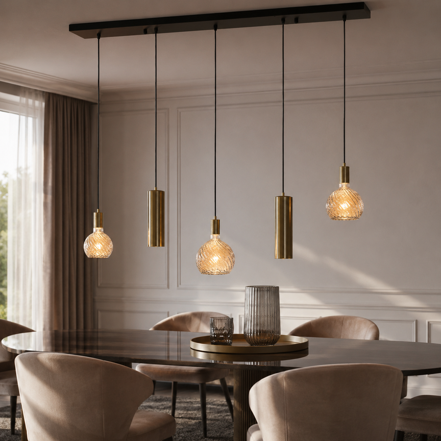 Tova 4353N pendant light suspended above a round wooden dining table in a contemporary classic interior avec velvet upholstered chairs and warm sunlight from window, 5xE27 black and brushed brass ceiling pendant lifestyle shot by Marcottestyle